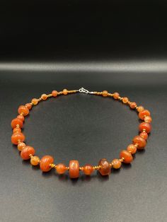 A beautiful collection of very old ancient Carnelian Beads Himalayan beads The origin of this beads are from Tibet . very unique shape of the carnelian some brass beads are used as spacers the age of this beads are more than 1000 years old we provide fast and free shipping service world wide Amber Beaded Necklace With Large Beads As Gift, Amber Beaded Necklaces With Large Beads For Gifts, Orange Agate Oval Beads Jewelry, Orange Agate Oval Beaded Jewelry, Amber Necklaces With Polished Oval Beads, Amber Oval Beads Necklace For Jewelry Making, Amber Carnelian Necklace With Polished Beads, Amber Oval Beaded Necklaces For Jewelry Making, Amber Beaded Necklaces With Round Beads For Gifts