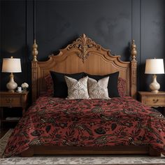 a bed with black and red comforter in a bedroom next to two nightstands