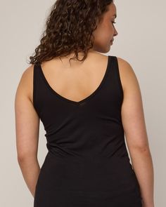 The women on our team can’t get enough of this tank. A layering piece that is comfortable, versatile, and has more length than other tanks you’re used to—made for tucking in or skimming the body for added coverage under other garments. Reversible front to back, allowing for either a scoop neck or v-neck option. Flatlock seams and just-right 1” width straps make it your most functional, everyday tank top. We recently updated this style (November 2023) to be a true slim layering tank. Chest, waist Everyday Tank Activewear, Athleisure Scoop Neck Top For Layering, Black Tank Top With Built-in Bra For Loungewear, Athleisure Scoop Neck Tank Top For Layering, Sporty Everyday Camisole, Racerback Tank Top With Built-in Bra, Athleisure Camisole Tank Top For Everyday, Seamless Construction Camisole For Layering, Bra Friendly Tank Top For Layering