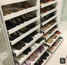 an organized shoe rack in a closet filled with women's shoes