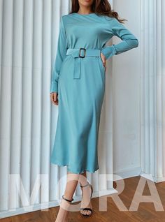 This silk long sleeve dress is modest and elegant. The belt underlines the waistline and transforms the body contour. The fabric is very pleasant to touch. Owing to the bias cut of the fabric, it ripples nicely and attractively.  Perfect modest outfit for wedding guests, bridesmaids, birthdays, anniversaries and office. DETAILS -  long-sleeved silk dress -  bias cut dress -  belted -  hits at mid-calf -  model is wearing a size S -  modest dress MATERIAL Silk and polyester blend SIZES Dress leng Light Blue Long Sleeve Formal Dress, Formal Light Blue Long Sleeve Dress, Modest Long Sleeve Maxi Dress For Work, Long Sleeve Maxi Dress For Office, Solid Long Sleeve Maxi Dress For Office, Solid Color Long Sleeve Maxi Dress For Office, Chic Light Blue Long Sleeve Maxi Dress, Office Maxi Dress With Long Sleeves, Elegant Light Blue Fall Dress