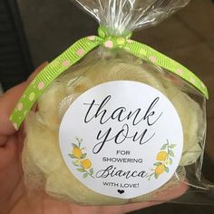 a hand holding a package of soap that says thank you for showering balance with love