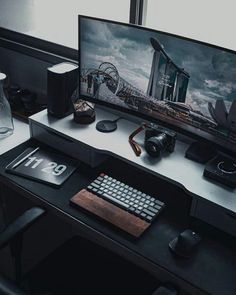 a computer desk with a monitor, keyboard and mouse