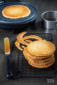 some waffles are stacked on top of each other and ready to be cooked