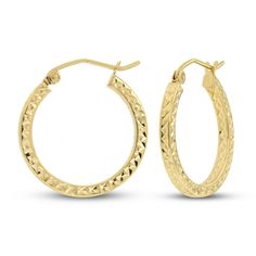 These beautiful hoop earrings for her are crafted in iconic 14K yellow gold and showcase a beautiful diamond cut finish. The textured hoops measure 20mm and secure with snap-lock clasps. Small Hoop Engraved Yellow Gold Earrings, Textured Hoop Jewelry For Gifts, Textured Hoop Jewelry Gift, Hinged 14k Gold Round Jewelry, Small Hoop Diamond Cut Earrings For Anniversary, 14k Gold Diamond Cut Hoop Earrings For Anniversary, Hinged Round 14k Gold Jewelry, Small Hoop Diamond Cut Earrings, Yellow Gold Hoop Jewelry With Diamond Cut