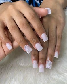 Short white nails are sophisticated and stylish for every occasion. There are many looks to choose, from casual to glam. Check out 19 short white nail ideas. #white #nail #design #ideas Cute Gel Nails White, White Silver Nails Short, Short White Nails Diamonds, Cute White Short Nails Designs, White Nail With Accent Nail, Nails Acrylic Square White, Homecoming Short Nails, Short Acrylic Nails For Graduation, Short Nails School Ideas