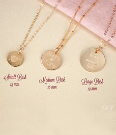 "This listing is for beautifully and dainty customizable disc necklace of your choice. Choose from 3 disk sizes and 3 metal choices. The engraving is completely customizable. This necklace looks great alone or layered! The charm can be engraved on one or both sides. ★ ★ TO ORDER: Please select from the first drop down menu your choice for engraving. The second drop down menu is for selecting your choice of metal, chain style, and necklace length. Add this item to your Etsy cart and when you proc Valentine's Day Round Necklaces With Engraving Option, Customizable Rose Gold Dainty Charm Necklace, Dainty Round Disc Jewelry For Mother's Day, Customizable Dainty Rose Gold Necklace, Dainty Customizable Rose Gold Necklace, Laser Engraved Round Disc Necklaces For Anniversary, Laser Engraved Round Disc Necklace For Anniversary, Rose Gold Round Disc Charm Necklace For Gift, Dainty Round Disc Necklace For Anniversary