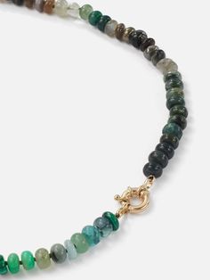 The Encirkled Camo Gemstone Beaded Necklace is the ultimate addition to your neck stack, featuring a 14k spring ring closure, that is perfect for displaying your favorite charms. 8mm assorted gemstones that may include agate, amber, aquamarine, aventurine, cat's eye, chocolate moonstone, chrysoprase, emerald, fluorite, chrysocolla, green onyx, jasper, labradorite, malachite, pyrite, sapphire, smoky quartz, tourmilated quartz Gemstone card comes with each necklace with list of included gemstones Everyday Spiritual Jewelry With Lobster Clasp, Everyday Necklaces With Natural Round Beads, Everyday Natural Stones Round Beads Necklace, Everyday Necklaces With Round Natural Stones, Spiritual Single Strand Round Jewelry, Everyday Round Necklaces With Natural Stones, Spiritual Single Strand Jewelry, Adjustable Gemstone Rondelle Necklaces, Adjustable Rondelle Gemstone Necklace