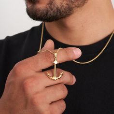 Elevate your nautical style with our 14K solid gold anchor pendant necklace for men. This boating-themed men's necklace is the perfect sailor gift, featuring a large anchor charm that's ideal for boat lovers. Crafted with attention to detail, it's a symbol of adventure and maritime passion. Discover the perfect accessory to express your love for the sea. -- ⋆ This product is designed with Runda's fine handcrafting with sustainable methods. ⋆ Express-insured shipping to the whole world and delivery to cargo in only 3 business days. ⋆ Free return and warranty Product Details * 14K Real Solid Gold * Black Enamel * Customizable Chain Size * Yellow - White - Rose Gold Available * Lobster Claw Clasp * Hypoallergenic * Model No X2P211693 -- ♻️ UPCYCLING THE FUTURE A more sustainable future is det Men's Necklaces, Gifts For Sailors, Anchor Pendant, Anchor Charm, Mens Necklace, Nautical Style, Nautical Fashion, Men's Necklace, Necklace For Men