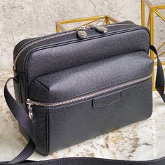 Black men's messenger bag series Restrained style with versatile and practical features This outdoor messenger bag is an attractive accessory choice Inspired by the 2018 spring and summer fashion show It is made of soft Taiga leather and is extra comfortable to carry on the back! 

Size 29.5x20x10.5cm Black Bag With Zipper Pocket For Business Trips, Black Bags With Zipper Pocket For Business Trips, Luxury Camera Bag With Removable Pouch For Travel, Black Crossbody Briefcase With Zipper Pocket, High-end Crossbody Shoulder Bag For Travel, High-end Travel Crossbody Shoulder Bag, Business Crossbody Camera Bag, Luxury Leather Shoulder Camera Bag, Black Shoulder Bag With Zipper Pocket For Business Trips