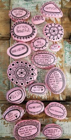 some pink stickers with words on them