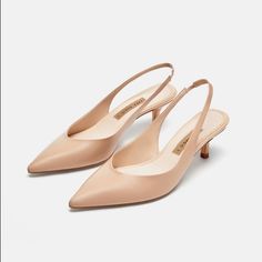 Genuine Zara New With Tag Material: Leather Upper Color: Nude Beautiful Nude Color..... Comfortable 1.9 Inch Heel... Great For Office Or With A Pretty Dress.. Euro Size 38 (7.5), 41(10) Beige Pointed Toe Sandals With 4-inch Heel, Feminine Slingback Heels, Beige Pointed Toe Kitten Heels, Beige Pointed Toe Slingback Pumps With 4-inch Heel, Feminine Beige Pointed Toe Heels, Classic Cream Slingback Pumps With Low Heel, Chic Cream Slingback Pumps With Pointed Toe, Elegant Beige Low Heel Slingback Pumps, Zara Low Heel Slingback Pumps For Formal Occasions