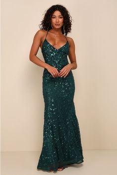 Get ready for 'gram-worthy pics all night when you're in the Lulus Photo Finish Forest Green Sequin Lace-Up Maxi Dress! Shiny green sequins create a floral design atop sheer mesh as it shapes this sultry dress that sweeps from tying straps that lace-up across a sexy open back and into a deep V-neckline and a darted bodice with padded cups. A high empire waist flows into a figure-skimming mermaid maxi skirt. Hidden back zipper. Fit: This garment fits true to size. Length: Floor length. Size mediu Sultry Dress, Emerald Green Prom Dress, Green Prom Dresses, Forest Green Dresses, Green Sequin Dress, Prom Dress Inspo, Embellished Maxi Dress, Green Prom, 2024 Prom