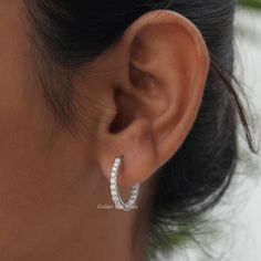 Round Cut Moissanite Huggies Earrings! Crafted with love and precision, these 14K Solid Gold Inside Out Hoop Earrings are perfect for any occasion. Whether it's an engagement gift for your wife. 𝐏𝐫𝐨𝐝𝐮𝐜𝐭 𝐕𝐢𝐝𝐞𝐨 𝐋𝐢𝐧𝐤: https://youtu.be/1bMOtJJgcws 𝐒𝐊𝐔: - GBJ1063 ✥ 𝐌𝐚𝐢𝐧 𝐒𝐭𝐨𝐧𝐞 𝐃𝐞𝐭𝐚𝐢𝐥𝐬 ↣ Shape: Round Cut ↣ Type: Moissanite ↣ Weight: 1.15 CTW (App.) ↣ Color/Clarity:  Colorless/VVS ↣ Making Process: Handmade - Crafted by our experienced team ✥ 𝐄𝐚𝐫𝐫𝐢𝐧𝐠𝐬 𝐃𝐞𝐭𝐚𝐢𝐥𝐬 ↣ Metal Purity: Solid Gold (10KT, 14KT, 18KT); Silver (925 Sterling, 935 Argentium), 950 Platinum ↣ Metal Tone: Yellow, White, Rose ↣ Stamp: Yes ✥ 𝐅𝐨𝐥𝐥𝐨𝐰 𝐔𝐬 Instagram:  @goldenbirdjewels  Facebook: @goldenbirdjewels Pinterest: @goldenbirdjewels Diamond White Halo Design Small Hoop Earrings, Diamond White Small Hoop Earrings With Halo Design, White Gold Cubic Zirconia Hoop Earrings For Wedding, Moissanite Halo Design Earrings, Wedding Cubic Zirconia Hoop Earrings, Wedding Round Hoop Earrings With Cubic Zirconia, Wedding Hoop Earrings With Cubic Zirconia, Gia Certified Sterling Silver Earrings, Moissanite Halo Earrings