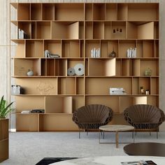 a living room filled with lots of wooden shelves