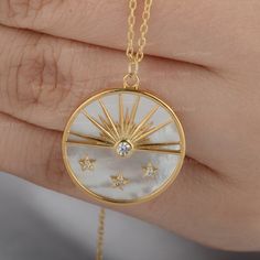 "Description Natural 2.35 Ct. Mother Of Pearl Gemstone Diamond Sun & Star Design Disc Pendant Necklace Solid 18K Yellow Gold Handmade Fine Jewelry Gift ≫ Features * Items Code: SBP0024 * Metal: 18K Solid Gold (14K also available - Additional fees may apply) * Solid 14K Yellow Gold with stamped * More options in gold color: Rose gold, yellow gold, White gold * Mother Of Pearl Weight:- 2.35 Ct. * Diamond Wt. :- 0.05 Ct * Diamond Color - G-H * Diamond Clarity - SI * Diamond Cut - Brilliant * Pendan Diamond White Round Celestial Necklace, Diamond White Celestial Round Necklace, Celestial Cubic Zirconia Round Necklace, White Cubic Zirconia Celestial Jewelry, Celestial White Jewelry With Birthstone, Celestial Hallmarked Necklaces For Anniversary, Luxury White Star-shaped Jewelry, Star Shaped Yellow Gold Gemstone Jewelry, Celestial Diamond Necklace With Polished Finish