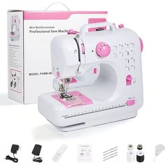 the sewing machine has pink trimmings on it's side and is next to its packaging