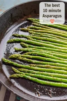 asparagus being cooked in a skillet with the words, the best 10 minute asparagus