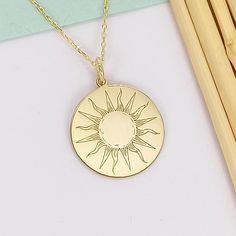 14k Solid Gold Sun Necklace, Engraved Sunshine Pendant, Custom Sunburst Charm Necklace, Dainty Sun Jewelry, Gift For Her  🟠We produce this product in 2 different materials, 14 carat solid gold and 925 sterling silver. and we also complete it in 3 different colors as rose, silver and gold 🟠The material you choose will be sent in the color you choose. 🟠It is free to type on the back 📏Pendant Diameters: 0,53 inches / 13,50mm 0,60 inches / 15,30mm 0,65 inches / 16,51mm (Size used in the ad) 0,70 Gold Round Laser Engraved Charm Necklaces, 14k Yellow Gold Sun Design Necklace, Gold Laser Engraved Round Pendant Necklace, Sterling Silver Necklace With Laser Engraved Round Pendant, Laser Engraved Round Yellow Gold Necklace, Sterling Silver Necklace With Yellow Gold Sun Design, Yellow Gold Medallion Necklace With Sun Design, Sun Design Medallion Necklace For Gift, Gold Laser Engraved Round Pendant Jewelry