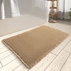 a bathroom with a rug on the floor