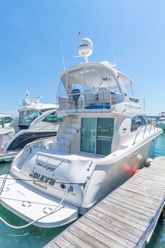 several boats docked at a pier in the water