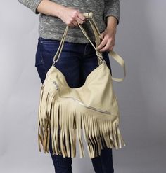 LEATHER BOHO BAG FRINGE LEATHER BAGSoft zippered leather bag.This Handbag is the perfect size to carry your daily essentials in style! It is made from high quality leather.This leather bag is a perfect everyday bag! There is a lot of space and you can put there everything in your everyday life.* Different colors* Lining* An external pocket on the back* Includes internal pockets for mobile phone and other small items.Dimensions:height: 31 cm (12.2 in)width: 39 cm (15.3 in)strap: max 130 cm (51.2 Beige Hobo Bag With Tassels For Daily Use, Daily Use Satchel Shoulder Bag With Tassels, Beige Fringe Shoulder Bag For Daily Use, Travel Crossbody Shoulder Bag With Tassels, Crossbody Shoulder Bag With Tassels For Daily Use, Daily Use Crossbody Shoulder Bag With Tassels, Beige Tassel Hobo Tote Bag, Beige Tote Hobo Bag With Tassels, Beige Fringed Hobo Bag For Daily Use