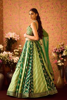 Step into refined elegance with the jasper green hand-embroidered silk brocade blouse, beautifully paired with a multi-panel brocade lehenga. This exquisite ensemble features intricate embroidery that enhances the luxurious fabric, while the lehenga adds depth and flair. An embroidered belt cinches the waist, and the matching dupatta completes the look, making it a perfect choice for festive celebrations and special occasions. Brocade Lehenga, Brocade Blouse, Green Lehenga, Brocade Blouses, Embroidered Belt, Casual Tunics, Green Hand, Silk Brocade, Silk Organza