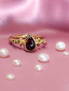 Elegant Garnet Stackable Rings, Yellow Gold Garnet Rings For Anniversary, Yellow Gold Garnet Solitaire Jewelry, Elegant Garnet Gemstone Stackable Rings, Garnet Solitaire Ring As Gift, Elegant Garnet Solitaire Birthstone Ring, Elegant Stackable Garnet Gemstone Rings, Yellow Gold Garnet Rings For Gifts, Gold Garnet Birthstone Ring