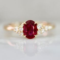 an oval shaped ruby and diamond ring