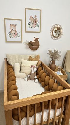 a baby crib with stuffed animals in it