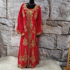 This Elegant 2 Pieces Red And Gold Embroidered Abaya Features Intricate Gold Ornate Embroidery Along The Neckline, Down The Front, And On The Edges Of The Sleeves And The Bottom Hem. The Set Includes One Dress And A Long Embroidered Kimono/Goddess Duster/Cover Up. Size: Large Bust:46" Hips:48" Length:58" Sleeves: 28" Elegant Red Kaftan With Zari Work, Red Floor-length Kaftan With Zari Work, Red Kaftan With Zari Work For Wedding, Red Zari Work Kaftan For Eid, Traditional Red Kaftan For Festive Occasions, Festive Red Kaftan With Dabka Work, Red Dabka Work Kaftan For Eid, Red Floor-length Dabka Kaftan, Red Anarkali Kaftan With Dabka Work