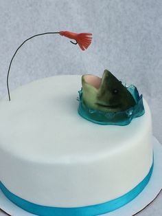 a white cake with a fish on top