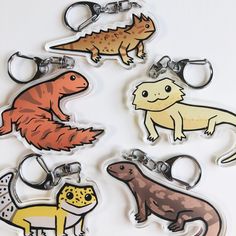 four different types of key chains with animals on them