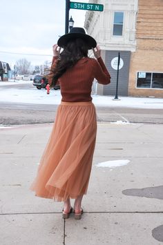 The Elastic Waist Maxi Tulle Skirt is a stunning and versatile addition to your wardrobe. This maxi skirt combines elegance with comfort, making it perfect for a wide range of occasions. Featuring an elastic waist, it offers a customizable and comfortable fit. The skirt is finished with a raw hem, which adds a contemporary touch to its overall design. It is fully lined, both in the body and skirt, providing comfort and coverage. Crafted from 100% polyester for both the self and lining, this skir Chic Tiered Skirt For Fall, Chic Stretch Tulle Maxi Skirt, Spring Stretch Tulle Maxi Skirt, Winter Tiered Tulle Skirt Bottoms, Fall Voluminous Skirt With Elastic Waistband, Flowy Maxi Skirt For Fall Party, Stretch Tulle Skirt Bottoms For Fall, Fall Flared Tulle Skirt Bottoms, Chic Stretch Full Maxi Skirt