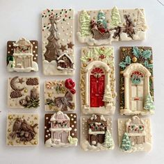 christmas cookies are arranged in the shape of small houses and windows with decorations on them