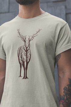 Visit my shop for more captivating designs! https://www.etsy.com/ca/shop/DigitalPrintApparel Abstract Deer Unisex Shirt, Wild Animal Tee, Animal Lover Gift, Safari Shirt, Zoologist Shirt, Deer Shirt, Animals Lover T-Shirt, Women's Tee Please visit my store to see more animal designs. https://www.etsy.com/shop/DigitalPrintApparel?ref=seller-platform-mcnav&section_id=36588049 Our Shirts feel soft and lightweight, with the right amount of stretch. It's comfortable and flattering for the whole family. Quality is important to us. Shirts are custom made to order and are printed using the latest ink to garment technology. This is not a cheap heat transfer or screen print. DTG uses specialty water-based inks, which are absorbed by the garment fibers. This technology leaves a smooth finish that nev Animal Tshirt Design, Deer Shirt, Animals Lover, Safari Shirt, Navy Blue Shirts, Animal Designs, Animal Tshirt, Wild Animal, Embroidered Tshirt