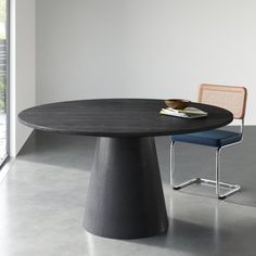 a round table with two chairs around it