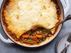 a casserole dish with meat and vegetables in it