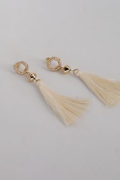 The Gracelyn Gold Tassel Earrings are the hit of the party! These trendy earrings start with a stud post back and have a tassel detail. Add these fun earrings to a black dress + heels to add a chic touch to your date night look! Gold Plated Tassels Stud Post Back One Size | Length 3” White Tassel Earrings For Party, Trendy Party Tassel Earrings, Tassel Earrings For Wedding, Elegant Beaded Tassel Earrings, Elegant Party Earrings For Spring, Elegant Spring Party Earrings, Elegant Tassel Earrings For Party, Chic Tassel Earrings For Evening, Chic Spring Earrings For Party