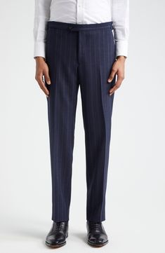 Pinstripes point up the precision tailoring of this structured suit cut from sumptuous wool in a single-breasted silhouette and framed with wide peaked lapels. Jacket has two-button closure; peaked lapels; four-button cuffs; chest welt pocket; front flap pockets; ticket pocket Trousers have zip fly with button-tab closure; front slant pockets; back button-welt pockets; adjustable waist Jacket is partially lined Trousers are unhemmed 100% wool Dry clean Made in Italy Designer Clothing Tailored Striped Double-breasted Suit For Business Casual, Tailored Striped Double Breasted Suit For Business Casual, Elegant Striped Pants With Welt Pockets, Striped Wool Suit For Workwear, Striped Wool Suits For Work, Striped Wool Suits, Classic Tailored Pinstripe Double Breasted Suit, Notch Lapel Suits With Vertical Stripes For Business Casual, Fitted Pinstripe Double Breasted Suit For Business Casual