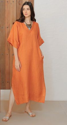 An absolute essential Kaftan dress made in comfortable and graceful Silk Linen fabric. The pipin detail on neck and sleeves just add to the magic. Dress has side slits and pockets for extra legroom and comfort. Makes for a perfect Holiday/Resort wear. Comes with a separate Cotton Lining to make for a comfort wear. Kaftan With Sleeves, Silk Fabric Dress Design, Kaaftaan Designs, Kaftan Pattern Kurti, Kaftan Kurti Designs, Linen Resort Wear, Unique Kaftan Designs, John Updike, Kaftan Kurti