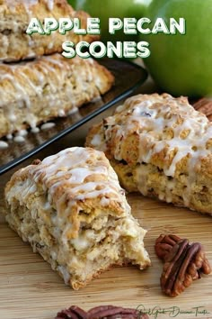 an apple pecan scones is cut in half and sitting on a cutting board