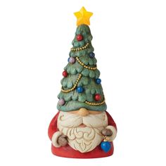 a ceramic christmas tree with a santa clause on it