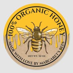 a sticker with a bee on it that says 100 % organic honey, net wt 32oz made with love by margaries