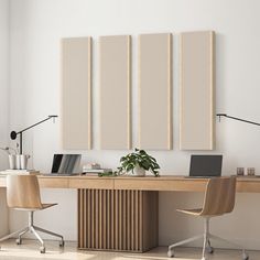 a desk with two chairs and three canvass on the wall