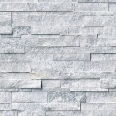 a white brick wall that is made out of grey marble blocks and has no mortars or mortars on it