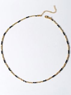 Experience the exquisite beauty of our handcrafted Black Spinel Gold Bean Mini Bead Necklace. Each element is carefully handcrafted to create a refined, elegant look. Add a touch of sophistication to any outfit with this versatile and glamorous necklace. Metal: 18ct Recycled Gold Plated On Brass Gemstone:Black Spinel Pearl: Freshwater Pearl 2.5mm Length: 400-450mm Weight: 5g Elegant Rondelle Beaded Necklace With Gold Beads, Elegant Beaded Necklace With Gold Rondelle Beads, Elegant Gold Necklaces With Black Beads, Elegant Gold Necklace With Black Beads, Elegant Black Rondelle Beaded Necklaces, Elegant Handmade Rondelle Beads, Handmade Elegant Rondelle Beads, Elegant Black Beaded Necklace With Tiny Beads, Elegant Gold Beaded Necklace With Tiny Beads