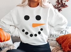 Funny Christmas Snowman Sweatshirt, Cute Family Matching Snowman Face Sweater For Women, Retro Vintage Xmas Holiday Party Crewneck Sweater HOW TO ORDER ➀ Select color ➁ Select the size (Please check size chart) ✦ True to size. Size up 1-2 sizes for an oversized look. ➂ Add to cart ✦ (Optional) "Add message to Seller" on the checkout page. GARMENT FEATURES ✦ Crew neckline ✦ Direct to garment printing - no vinyl, decal, or iron-on technique ✦ Our designs are printed on the garment to last a long time and may not appear as 'glossy' or saturated as iron-on designs are. ✦ Please note that colors may appear different on different digital screens and may not be a true representation of the actual colors. ✦ Additional T-Shirt Colors and Sizes Available Upon Request ✧✧Brands: Bella Canvas Unisex 30 Fun Winter T-shirt With Crew Neck, White T-shirt For Winter, Fun Winter Crew Neck T-shirt, White Crew Neck Sweatshirt For The Holidays, White Crew Neck Holiday Sweatshirt, White Crew Neck Sweatshirt For Holiday, Fun Crew Neck T-shirt For Winter, Holiday White Crew Neck Sweatshirt, White Holiday Crew Neck Sweatshirt