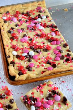 valentine's day cookie bars with sprinkles and chocolate chips on top