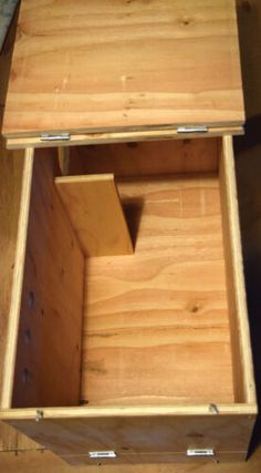 an open wooden box sitting on top of a table